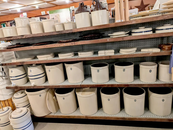 Ohio Stoneware crocks, water crocks, lids and jugs in stock on the shelves at Red Hill General Store in Hillsville, Virginia